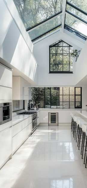 Open-plan kitchen extension with skylights.